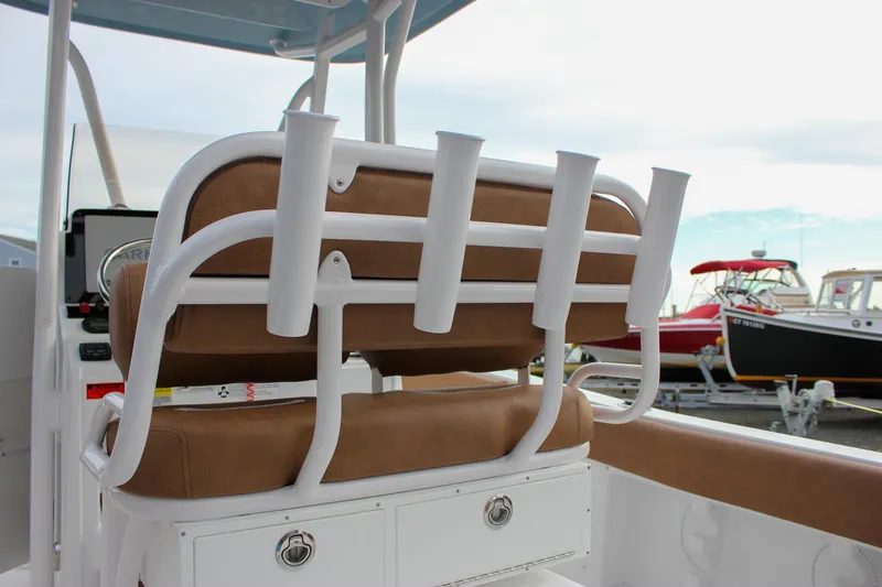 Slide: The Image of 2026 Sea Hunt Ultra 219 boat with rod holders and cushioned seating. - 35