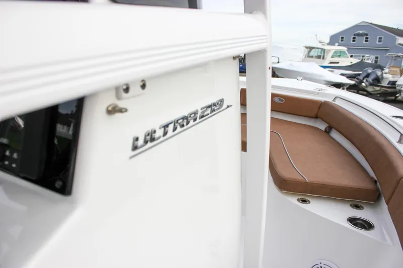 Slide: The Image of 2026 Sea Hunt Ultra 219 boat with brown seating and sleek design. - 41