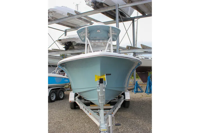 Slide: The Image of 2026 Sea Hunt Ultra 219 boat on trailer, stored outdoors. - 51