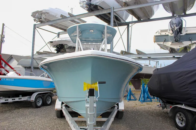 Slide: The Image of 2026 Sea Hunt Ultra 219 boat on trailer in storage facility. - 8