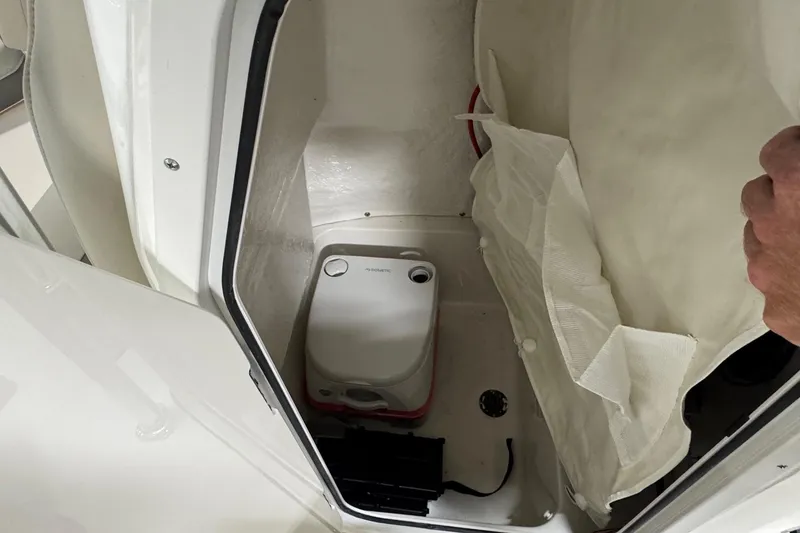 Slide: The Image of Interior of 2026 Key West 203 FS boat with compact portable toilet. - 12