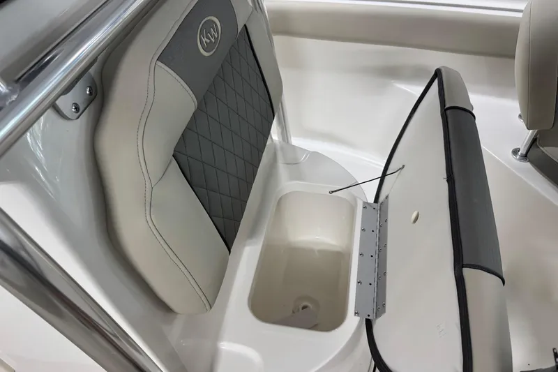 Slide: The Image of 2026 Key West 203 FS boat seat with storage compartment open. - 9