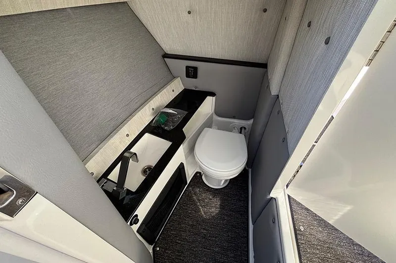 Slide: The Image of 2021 Cobalt R6 boat interior bathroom with sink and toilet. - 13