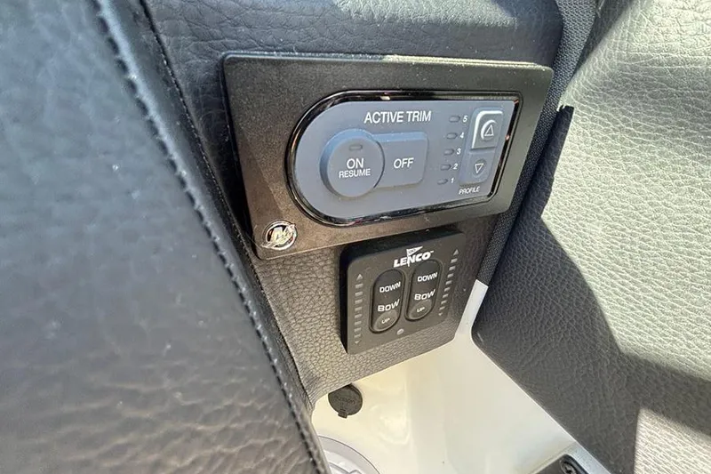 Slide: The Image of Control panel in 2021 Cobalt R6 boat with Active Trim and Lenco buttons. - 16
