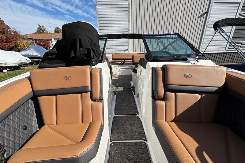 Slide: The Image of 2021 Cobalt R6 boat interior with tan leather seating and modern design. - 23