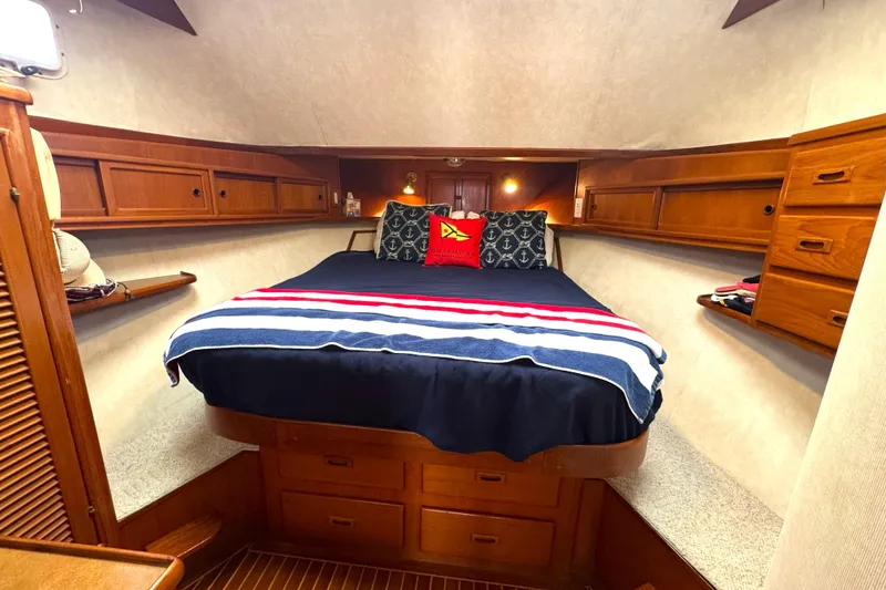 Slide: The Image of Cozy cabin interior of 1988 Offshore Yachts 48 Sedan with nautical decor. - 10