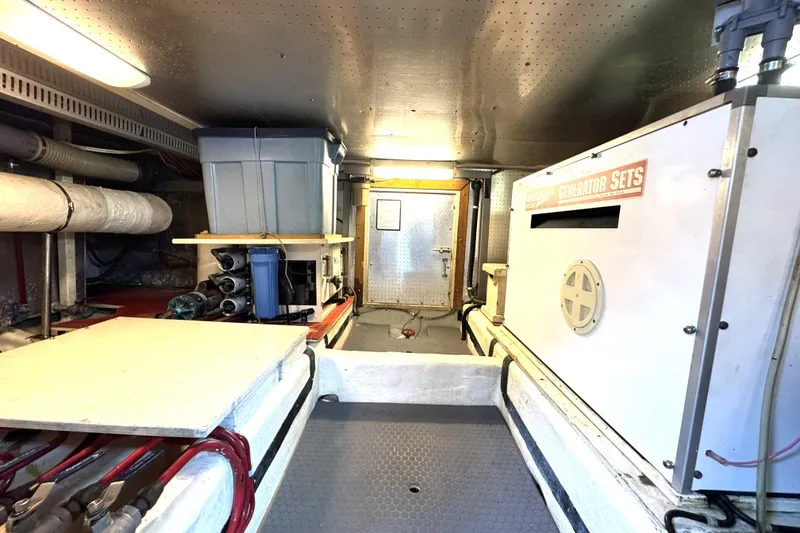 Slide: The Image of Engine room of 1988 Offshore Yachts 48 Sedan with generator and storage. - 20