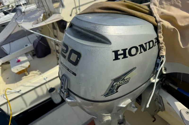 Slide: The Image of Honda 20 horsepower four-stroke outboard motor on 1988 Offshore Yachts 48 Sedan. - 21