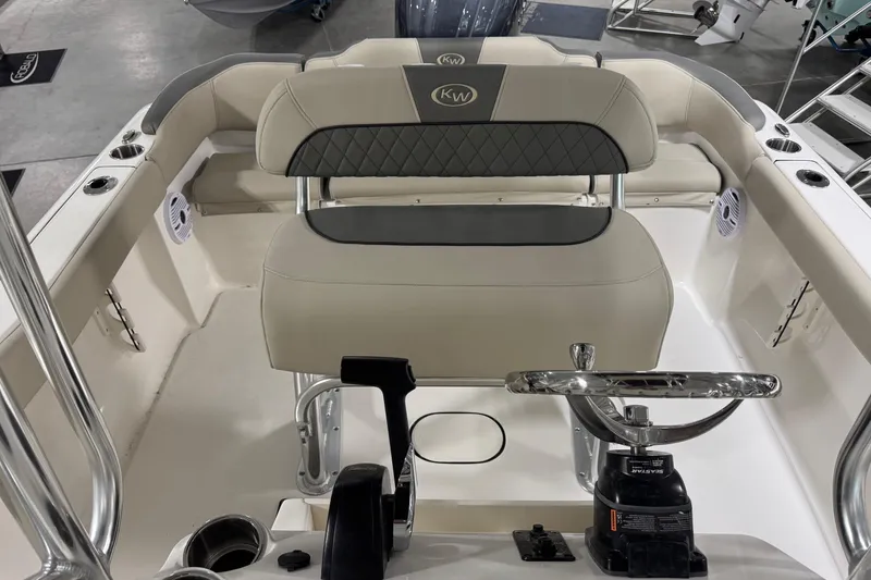 Slide: The Image of 2026 Key West 203 FS boat interior with steering wheel and seating. - 10