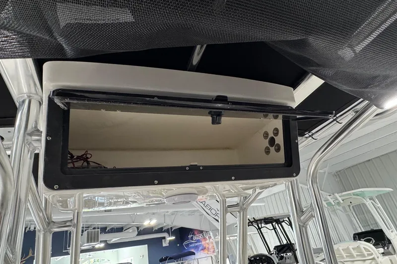 Slide: The Image of Open storage compartment on a 2026 Key West 203 FS boat, showcasing interior details. - 14
