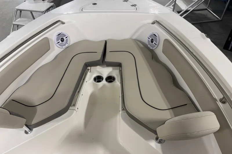 Slide: The Image of 2026 Key West 203 FS boat interior with beige seating and built-in speakers. - 4