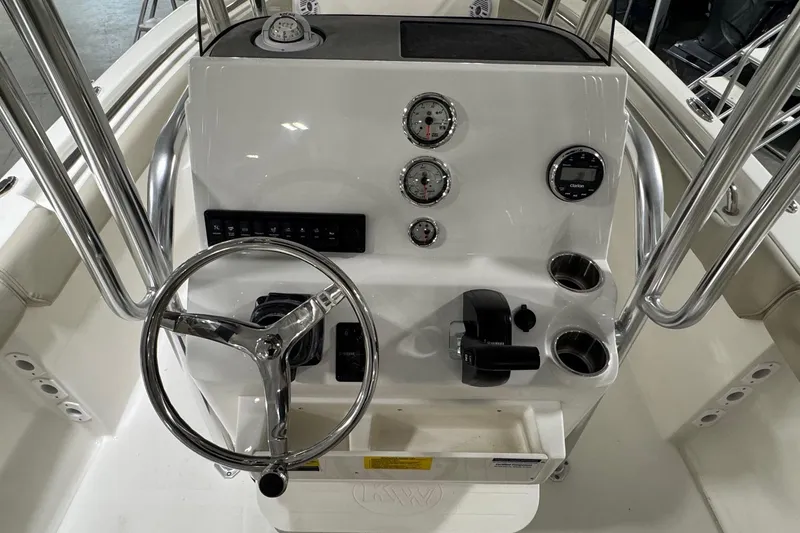 Slide: The Image of 2026 Key West 203 FS boat dashboard with steering wheel and gauges. - 13