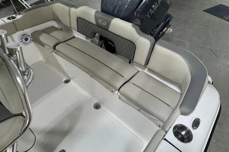 Slide: The Image of 2026 Key West 203 FS boat interior with cushioned seating and speaker system. - 15