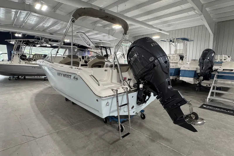 Slide: The Image of 2026 Key West 203 DFS boat with Yamaha outboard motor in showroom. - 2