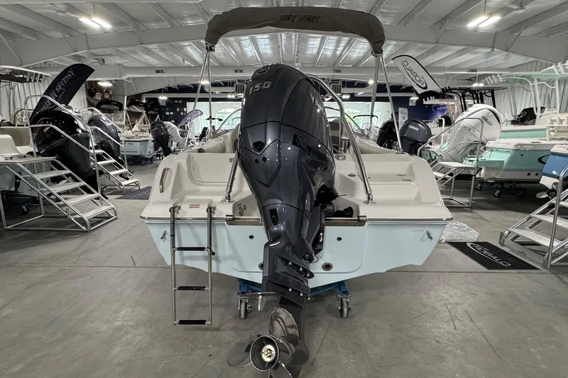 Slide: The Image of 2026 Key West 203 DFS boat in showroom with Yamaha outboard motor. - 3