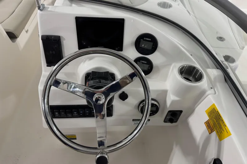 Slide: The Image of Steering console of 2026 Key West 203 DFS boat with gauges and controls. - 9