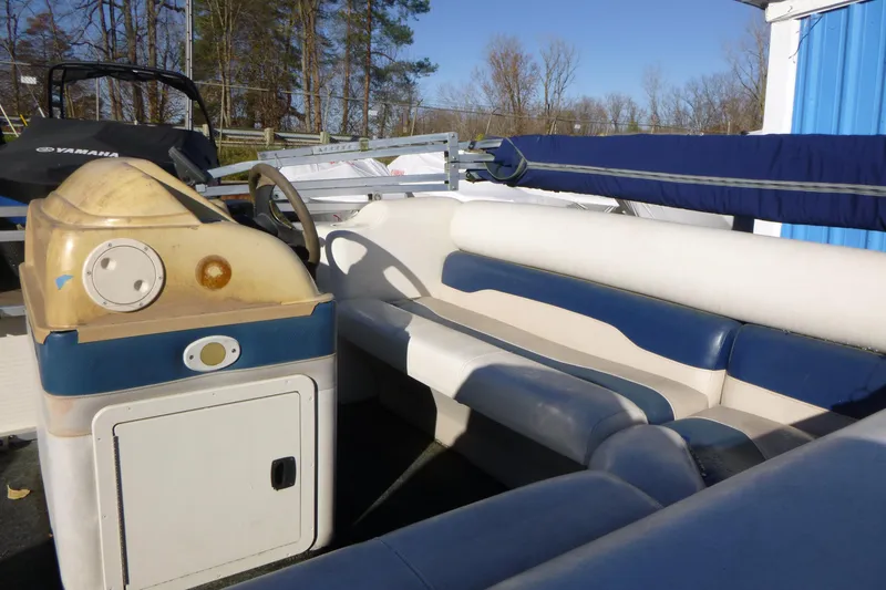 Slide: The Image of 2003 Smoker Craft 816 Infinity Fish boat interior with blue and white seating. - 12