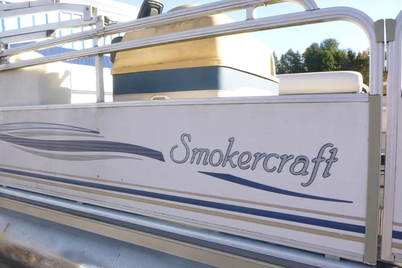 Slide: The Image of 2003 Smoker Craft 816 Infinity Fish pontoon boat with logo and design details. - 3