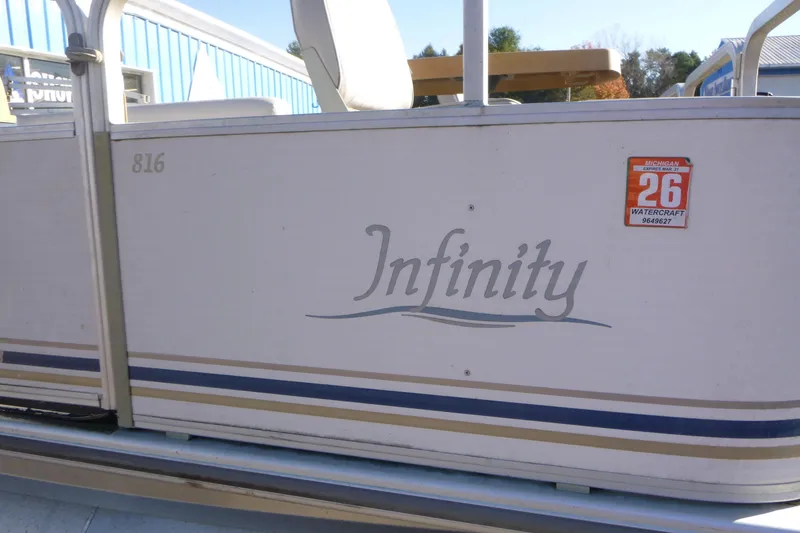 Slide: The Image of 2003 Smoker Craft 816 Infinity Fish boat with Michigan registration sticker. - 4