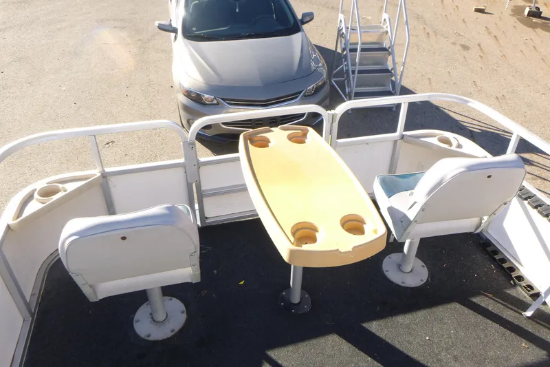 Slide: The Image of 2003 Smoker Craft 816 Infinity Fish boat interior with seating and table. - 9