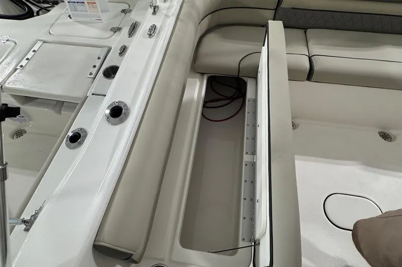 Slide: The Image of Interior view of 2026 Key West 203 DFS boat, featuring seating and storage compartments. - 12