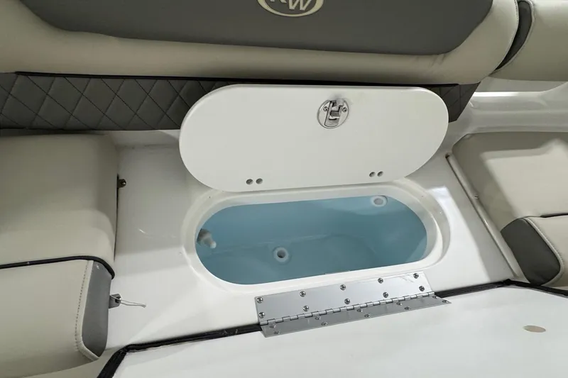 Slide: The Image of 2026 Key West 203 DFS boat interior with open storage compartment. - 13