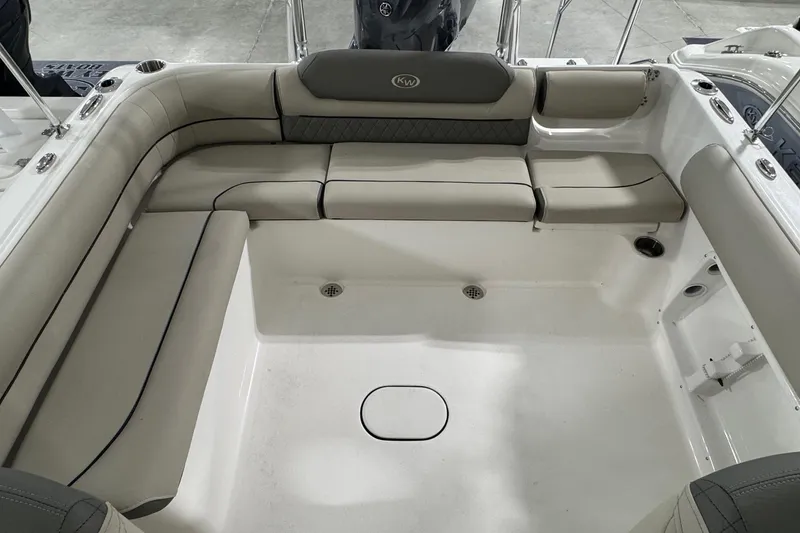 Slide: The Image of 2026 Key West 203 DFS boat interior with cushioned seating and spacious layout. - 11