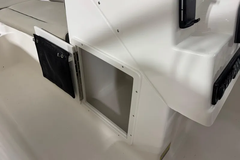 Slide: The Image of 2026 Key West 203 DFS boat interior storage compartment with black mesh pocket. - 14