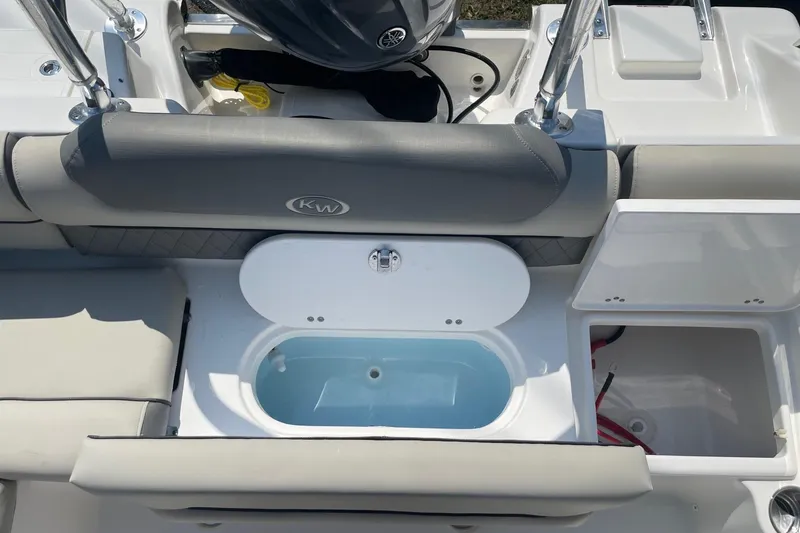 Slide: The Image of Key West 203 DFS 2026 boat interior with seating and storage compartments. - 5
