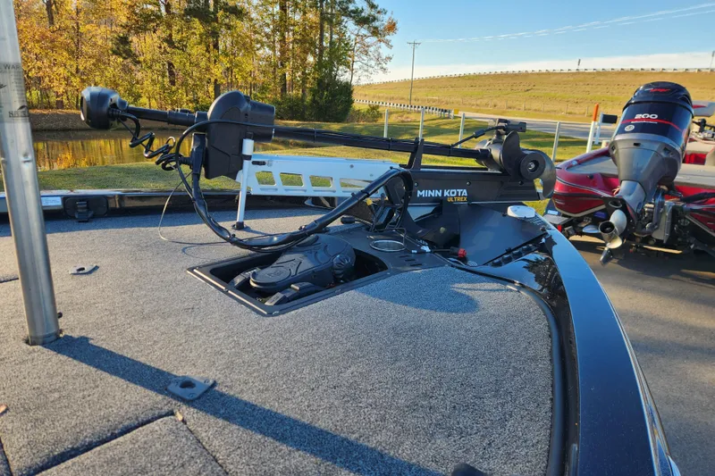 Slide: The Image of 2020 Ranger Z519 boat with Minn Kota Ultrex trolling motor, parked near a scenic pond. - 11