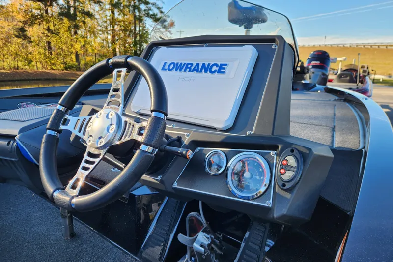 Slide: The Image of 2020 Ranger Z519 boat dashboard with Lowrance display and steering wheel. - 12