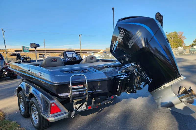 Slide: The Image of 2020 Ranger Z519 boat with powerful 225 engine, parked on a sunny day. - 4