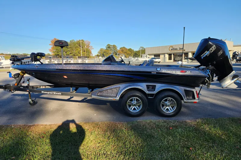 Slide: The Image of 2020 Ranger Z519 boat on trailer, parked outdoors, with a Mercury Pro XS engine. - 6