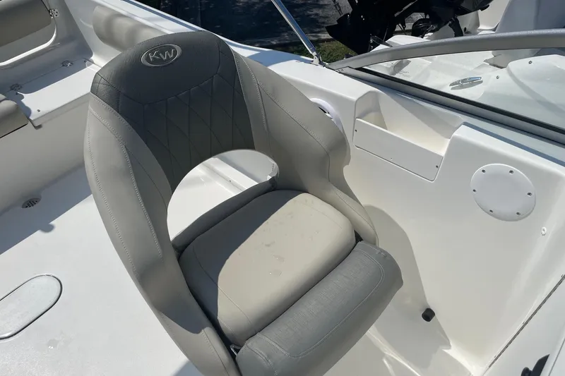 Slide: The Image of Gray captain's chair on 2026 Key West 203 DFS boat, featuring sleek design and comfortable seating. - 12