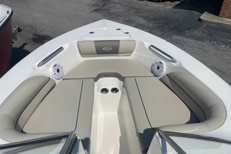 Slide: The Image of Bow seating area of 2026 Key West 203 DFS boat with speakers and cup holders. - 16