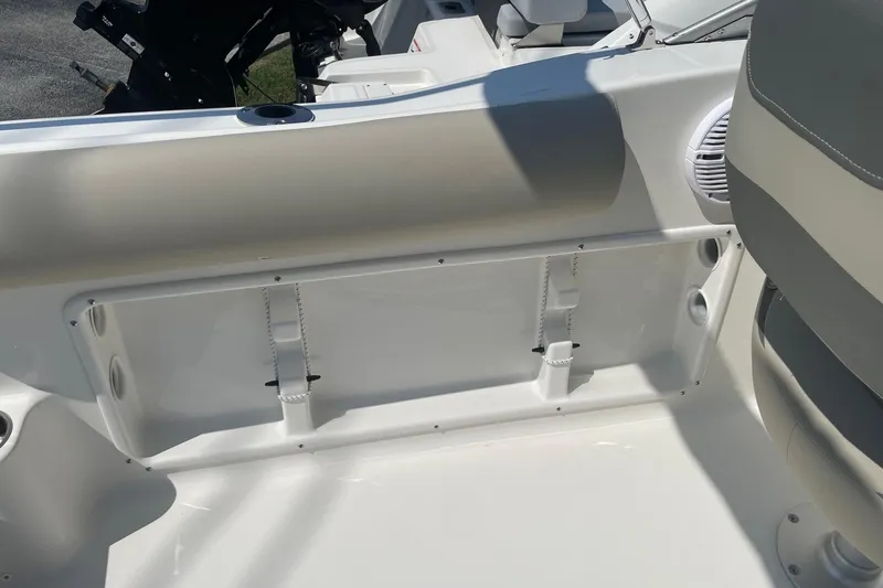 Slide: The Image of 2026 Key West 203 DFS boat interior with seating and storage compartment. - 6