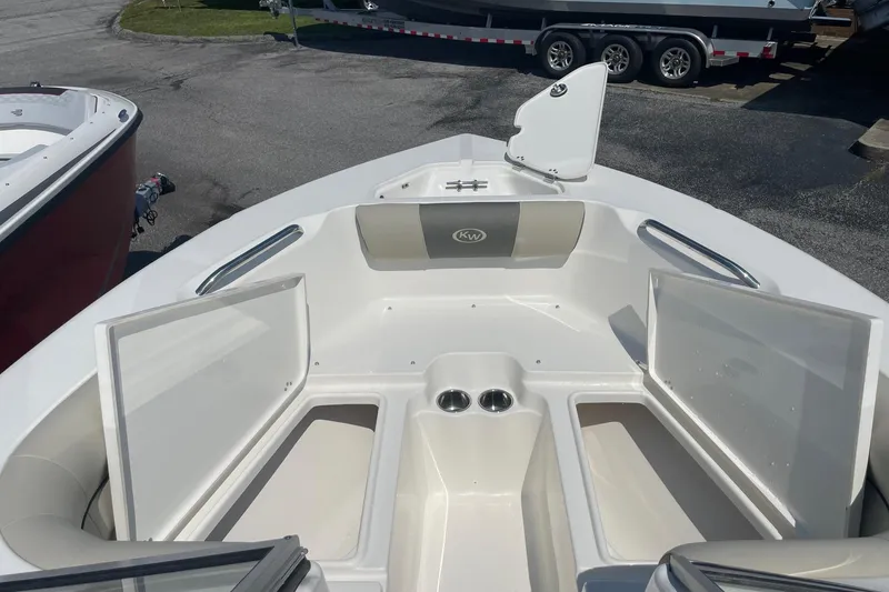 Slide: The Image of 2026 Key West 203 DFS boat interior with open storage compartments and seating. - 8