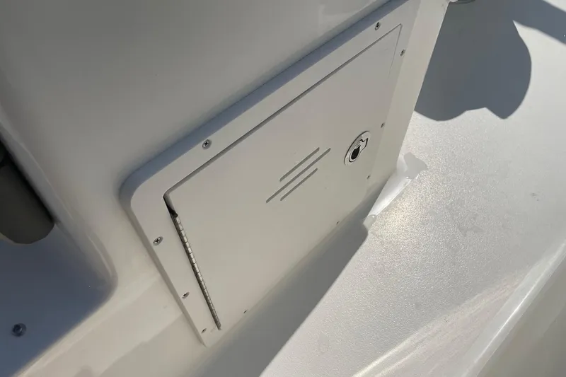 Slide: The Image of Access panel on 2026 Key West 203 DFS boat, featuring sleek design and secure lock. - 9