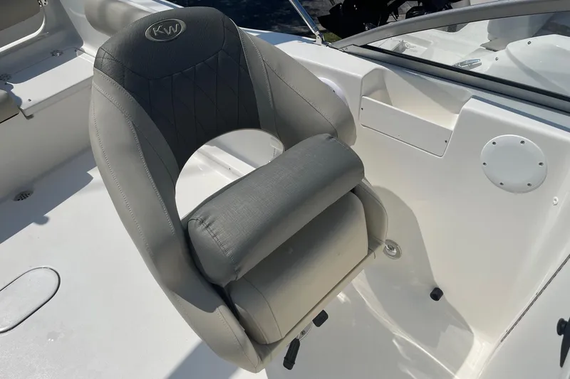 Slide: The Image of Captain's seat on 2026 Key West 203 DFS boat, featuring gray upholstery and ergonomic design. - 11