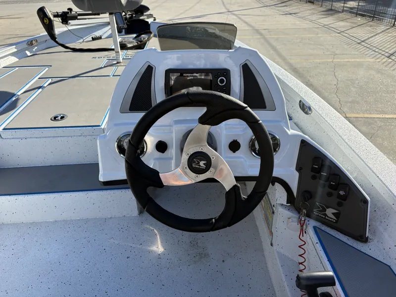 Slide: The Image of 2022 Xpress H18 boat deck with Minn Kota trolling motor and control panel. - 10