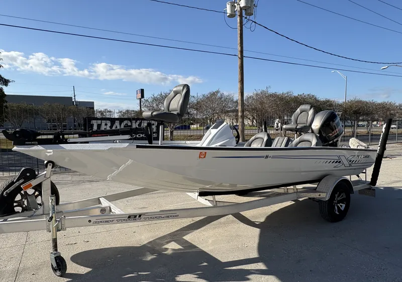 Slide: The Image of 2022 Xpress H18 boat with Yamaha engine on trailer, parked outdoors. - 3