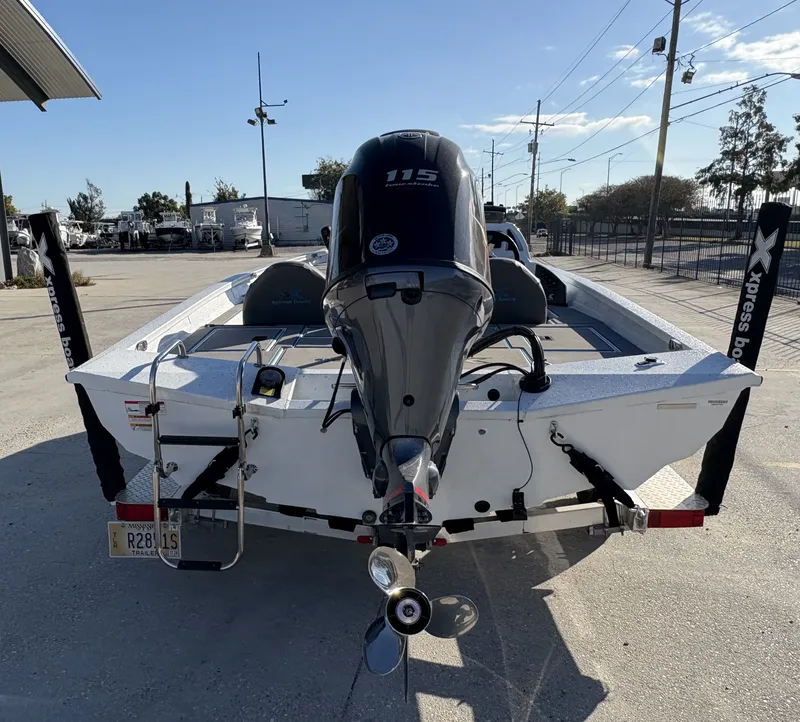 Slide: The Image of 2022 Xpress H18 boat with 115 horsepower engine, parked outdoors. - 4