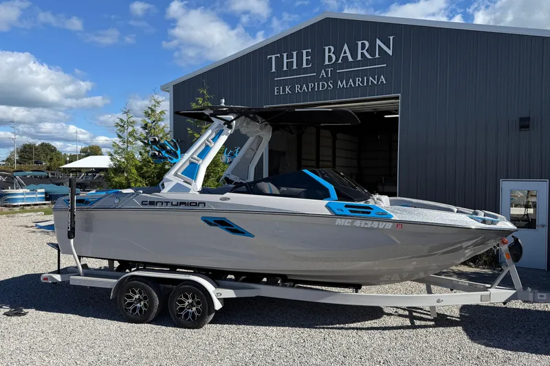 The Image of 2025 Centurion Ri230 boat on trailer at Elk Rapids Marina. - 1