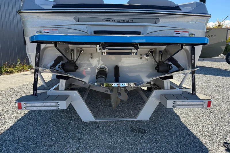 Slide: The Image of 2025 Centurion Ri230 boat rear view, showcasing sleek design and advanced features. - 15