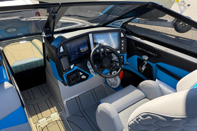 Slide: The Image of 2025 Centurion Ri230 boat interior with modern dashboard and steering wheel. - 7