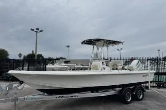 The Image of 2023 Bulls Bay 2400 boat on trailer, parked outdoors, overcast sky. - 1