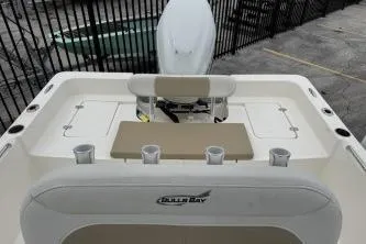 Slide: The Image of 2023 Bulls Bay 2400 boat interior with seating and rod holders. - 6