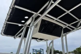 Slide: The Image of 2023 Bulls Bay 2400 boat T-top with integrated lights and electronics. - 9