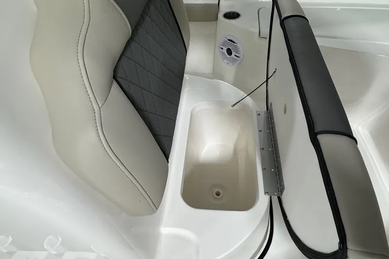 Slide: The Image of 2026 Key West 210 Bay Reef boat seat with storage compartment and speaker. - 9