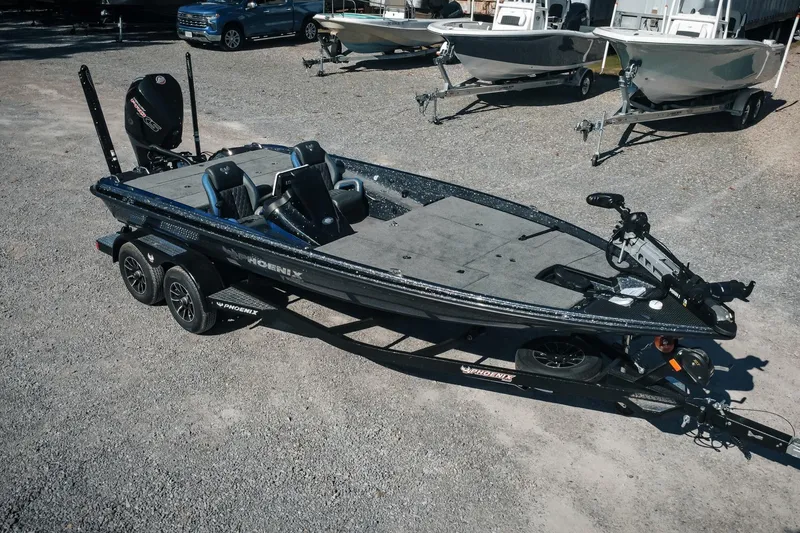 The Image of 2026 Phoenix 721 ZXL bass boat on trailer in outdoor setting. - 1